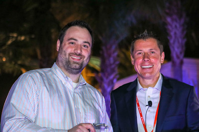 Ryan Lynch (left), Managing Director of GTM's Tax Automation Services (TAS) practice, receives the 2018 Taxologist of the Year award in the Certified Implementer Program category from Piotr Marczewski (right), president, Corporates Customer Market, Thomson Reuters (photo courtesy of Thomson Reuters).