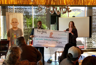A check for $176,000 was presented to Trumaine Thomas (left), regional development director, St. Jude, by Hannah Thompson, director of marketing and public relations for Texas de Brazil, at a sell-out luncheon held at the Brazilian-American steakhouse in Dallas on October 21. All monies raised during the Texas de Brazil fundraising campaign will directly benefit St. Jude patients with childhood cancer and other life-threatening diseases.