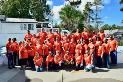 Employees at Myrtle Beach's National Hospitality participate in cleaning up local homes damaged by Hurricane Florence.
