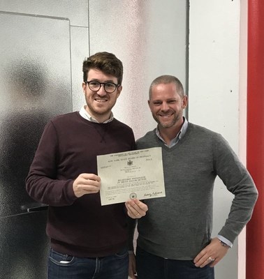 President Julian Wolfe and Dr. Anthony Martincic, Pharm.D holding the New York State Board Registered Wholesaler of Drugs Certificate for PCS Inc.