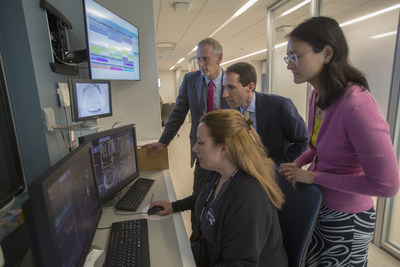 NYU School of Medicine Department of Radiology chair, Michael Recht, MD; Daniel Sodickson, MD, PhD, vice chair for research and director of the Center for Advanced Imaging Innovation and Research; and Yvonne Lui, MD, director of artificial intelligence, watch an MRI exam take place with at NYU Langone Health in New York.