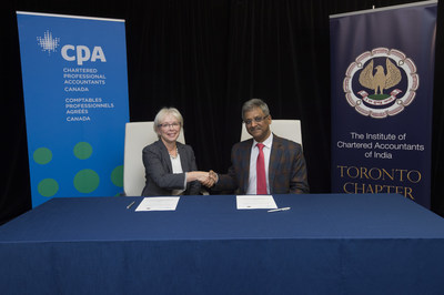 Joy Thomas (left), president and CEO of Chartered Professional Accountants of Canada, and Naveen N. D. Gupta, president of the Institute of Chartered Accountants of India, sign a Memorandum of Understanding between Canada's CPAs and India's CAs in Toronto on November 17, 2018. (CNW Group/CPA Canada)