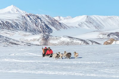 Husky dog sledding in Ittoqqortoormiit, Greenland by Christoffer Collin