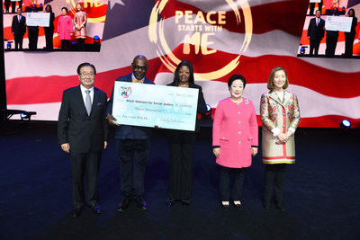 UNIONDALE, NY - NOVEMBER 12: A donation to Black Veterans for Social Justice is presented during Peace Starts With Me concert at Nassau Coliseum. (Photo by Mike Pont/Getty Images for Family Federation for World Peace and Unification USA)