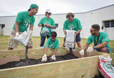 Volunteers work at Sunrise Middle School in Fort Lauderdale during the 2018 Comcast Cares Day on April 21.