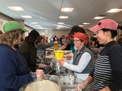 Pictured: ASTM International staff individual package more than 35,000 meals for Rise Against Hunger