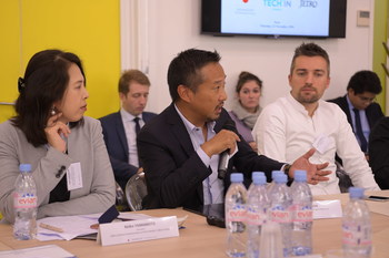 Kei Shimada, Director of Innovation, Leader of Digital Makers Lab, IBM Japan talking to members of the Paris start-up community at a business roundtable held in Paris on 22 November 2018, hosted by the Government of Japan and supported by Tech In France (next to him: Keiko Yamamoto, Counselor, Prime Minister’s Office of Japan and Bastien Nowicki, Development and Operating Manager, TECH In France. (PRNewsfoto/Government of Japan)