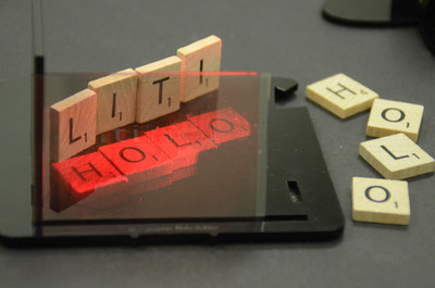 A real hologram make with the Litiholo Hologram Kit showing holographic letter blocks that look almost as real as their non-holographic versions sitting next to them.