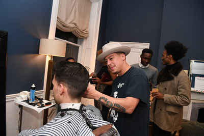 Guests receive complimentary beard cleanup at Trunk Club and Esquire's event benefitting the Movember Foundation