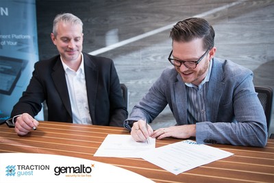 Keith Metcalfe, CEO of Traction Guest, and Robert Cimperman, VP Sales and Marketing North America at Gemalto, sign a preferred partnership agreement to integrate Gemalto's airport-grade ID scanners with Traction Guest's visitor management platform to strengthen enterprise security. (CNW Group/Traction Guest)