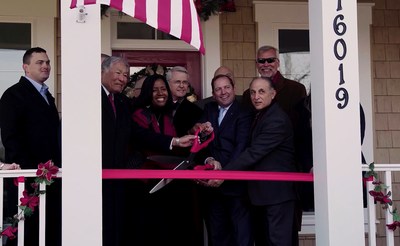 James Schenck, President/CEO, PenFed Credit Union and CEO, PenFed Foundation (center) cuts the ribbon for the PenFed Foundation Home to Serve Our Willing Warriors grand opening with Shirley Dominick (left of center) and John Dominick (right of center), Co-Founders of Serve Our Willing Warriors.