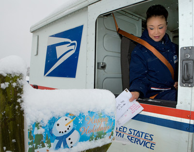 USPS carrier delivers mail, Photo courtesy: USPS