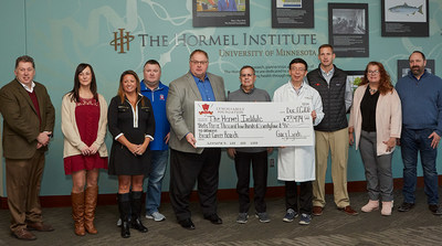Gary Lynch (center), owner of The Lynch Companies, presents a check to Dr. Zigang Dong, executive director The Hormel Institute. Left to right: Mark Morey, vice president of affiliated businesses Hormel Foods, Melissa Blockhus, The Lynch Compaines, Erin Golly, The Lynch Companies, Jason Golly, CEO of The Lynch Companies, Tom Day, executive vice president of refrigerated foods Hormel Foods, Lynch, Dr. Dong, Matt Hackfort, senior director of raw supply Applegate, Christy Bouska & Kevin Bouska, The Lynch Companies.