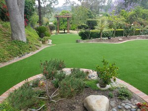 Artificial Grass Installation Enhances a Backyard Oasis