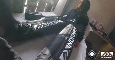 Carle Brenneman of Canada Snowboard's Snowboardcross National Team recovering with NormaTec.