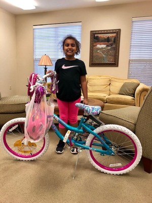 Mikayla Munir of Little Rock Family Housing is all smiles after winning a new bicycle from Hunt Heroes Foundation Mikayla Munir of Little Rock Family Housing is all smiles after winning a new bicycle from Hunt Heroes Foundation