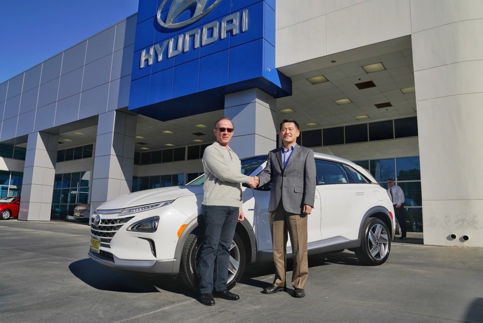 Yong-woo (William) Lee, president and CEO of Hyundai Motor North America, congratulates Todd Hochrad of Ventura, Calif., the first customer to receive the all-new Hyundai Nexo. Nexo is the only mass-produced fuel cell SUV for the U.S. market, boasting a range up to 380 miles.