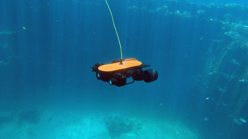 Titan: Not only is the Titan underwater drone the world's first underwater drone with a robotic arm, it is also the deepest diving underwater drone with a 4K camera, able to dive up to 492ft and has extension support. Since it comes with precise hovering and is capable of high and low angle photography (-60°~ 60°), Titan is perfect for professional underwater filming.