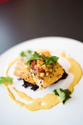Seared tempeh with black rice, coconut curry sauce, and pineapple and red onion relish prepared as part of the curriculum of the Natural Gourmet Center at the Institute of Culinary Education. Students receive a Health-Supportive Culinary Arts diploma.