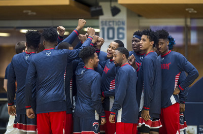 The Howard University Men's Basketball team huddles during a game.