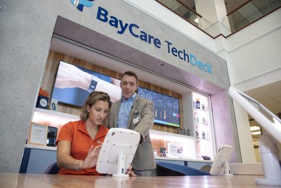 BayCare’s director of Innovation, Craig Anderson, and health tech coach, Beth Weiner, test one of the iPads at BayCare TechDeck.
