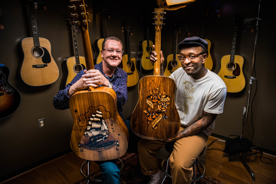 Scott Sasser (left) of C.F. MARTIN & CO.® and Sailor Jerry Spiced Rum Ambassador, Daniel "Gravy" Thomas (right) showcase the Ink & Wood special edition guitar series.