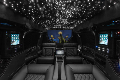 Lexani Motorcars Cadillac Escalade 30" Extended Viceroy Captain's Quarters featuring magnetic docked I-Pads, control 4 touchscreen management console, and 48" curved Smart TV