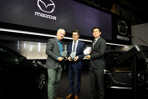 Massey Kondo, President, Mazda Canada, and Jacques Parent, Quebec Regional Manager, Mazda Canada, accept three AJAC awards from Mark Richardson, President, AJAC (CNW Group/Mazda Canada Inc.)