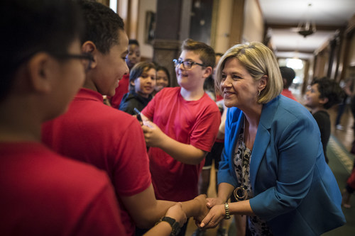 As part of her 2018 Tom Hanson Photojournalism Award experience, Tijana Martin captured this image of Ontario NDP leader and leader of the official opposition Andrea Horwath shaking hands with students from St. Joseph Richmond Hill Catholic Elementary School at Queen's Park in Toronto on June 8, 2018. THE CANADIAN PRESS/ Tijana Martin (CNW Group/Canadian Journalism Foundation)