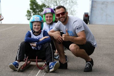 USA Luge athlete and Winter Olympic sliver medalist, Chris Mazdzer, teaches children how to luge during the White Castle USA Luge Slider Search.