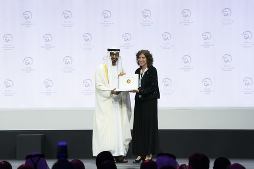 ABU DHABI, UNITED ARAB EMIRATES - January 14, 2019: HH Sheikh Mohamed bin Zayed Al Nahyan, Crown Prince of Abu Dhabi and Deputy Supreme Commander of the UAE Armed Forces (L), presents an award to Dr. Laura Stachel, Executive Director and Co-founder of 'We Care Solar,' winner of the Zayed Sustainability Prize