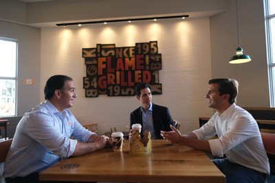 (L to R): Jose Cil (CEO of RBI), Daniel Schwartz (Executive Chairman of RBI and co-Chairman of RBI’s Board of Directors), and Josh Kobza (COO of RBI) meet at a Burger King restaurant in South Beach, Miami. (CNW Group/Restaurant Brands International Inc.)