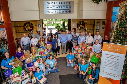 Associates at Marriott Vacations Worldwide's Corporate Headquarters in Orlando, Fla. with a portion of their local food donation for the annual Harvest for Hunger food drive.