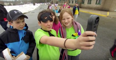 Students search for the windiest spot to test the anemometers they made (CNW Group/Royal Canadian Geographical Society)