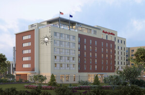 White Lodging Celebrates Construction Milestone of New Hampton by Hilton Hotel