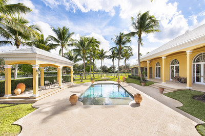 A courtyard-style pool enjoys gentle, natural breezes, and is surrounded by a large, paved terrace for plenty of sunbathing. More at WellingtonLuxuryAuction.com.