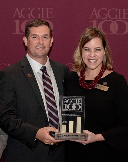 Dr. Emily Kirby & Randol Kirby receiving the Aggie 100 award