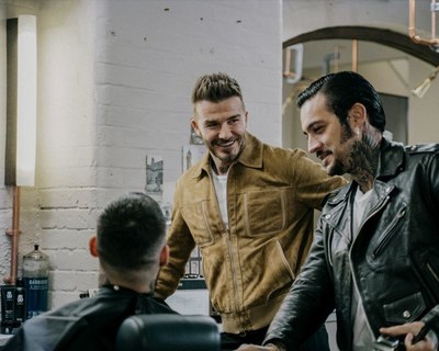 David Beckham surprises HOUSE 99 fans, As part of House 99 first anniversary celebrations a grooming experience was gifted to 10 customers in London. The lucky 10 chosen were surprised by brand founder, David Beckham dropping by the barbershop (PRNewsfoto/HOUSE 99 by David Beckham)