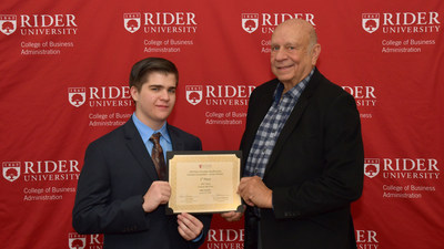 From left, high school senior Eric Voros poses with entrepreneur Norm Brodsky '64 after winning a full, four-year tuition scholarship to Rider University in the 2019 Norm Brodsky Business Concept Competition.