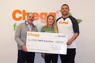 Chegg CEO Dan Rosensweig presents a charitable contribution to Julie Johnston Ertz and Zach Ertz for The Ertz Family Foundation