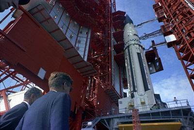 Caption: Senator George Smathers of Florida and President John F. Kennedy at Pad B, Complex 37, Cape Canaveral, Florida, where they were briefed on the Saturn rocket. November 16, 1963. Credit: Cecil Stoughton, White House/John F. Kennedy Presidential Library and Museum Caption: Senator George Smathers of Florida and President John F. Kennedy at Pad B, Complex 37, Cape Canaveral, Florida, where they were briefed on the Saturn rocket. November 16, 1963. Credit: Cecil Stoughton, White House/John F. Kennedy Presidential Library and Museum