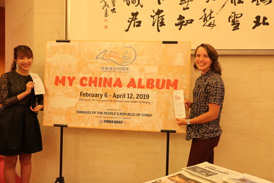 Guests pose for photos at the My China Album sign at the Chinese Embassy in Washington on Wednesday. [Photo by Zhao Huanxin/China Daily]