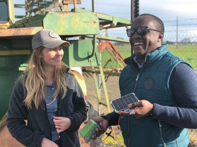 Left, Stephanie Tatge, Ecosystem Services Analyst for The Freshwater Trust and Nathan B Wangusi, Technical Lead for Water Research, IBM Research - Africa, holding a low-cost satellite sensor from SweetSense Inc.