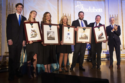 Johnny Morris, founder and CEO of Bass Pro Shops, third from right, accepts the Audubon Medal with his wife Jeanie Morris, fourth from left, and their three children during the 2019 Audubon Gala at The Plaza Hotel Thursday, Feb. 7, 2019 in New York City.