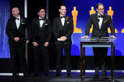 From right to left: Eric Dachs, PIX Founder and CEO accepts the AMPAS Sci-Tech Technical Achievement Award accompanied by the PIX System development team including Paul McReynolds, Erik Bielefeldt, and Craig Wood. (Courtesy of AMPAS)