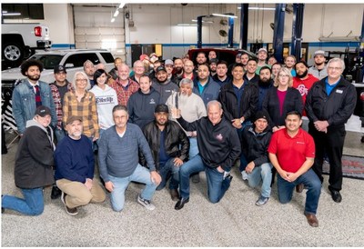 Pictured, the Classic Chevrolet Parts team.  Tom Durant with trophy in front row. Tom Cross far right.