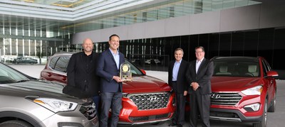 (left to right) Barry Ratzlaff, vice president of customer satisfaction, Hyundai Motor America, Omar Rivera, director, quality and service engineering, Hyundai Motor America, Brian Smith, chief operating officer, Hyundai Motor America and Robert Mansfield, senior director, global automotive at J.D. Power celebrate the Hyundai Santa Fe’s win as the most dependable Midsize SUV in the J.D. Power 2019 Vehicle Dependability Study.