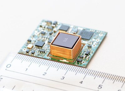 Figure 1. Prototype of the atomic clock (33mm x 38mm x 9mm): A newly developed compact ULPACs, mounted on small satellites, automobiles, and smartphones, accelerate the realization of seamless and on-demand mobile communication networks.