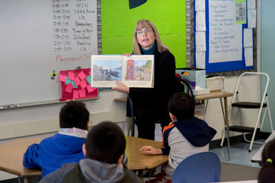 At the official kick-off of IditaREAD 2019, ExxonMobil Alaska's President, Darlene Gates, reads to a group of students at Nunaka Valley Elementary School in Anchorage, AK.