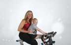 A mother and her daughter sit on a Life Time bike for Ride for a Reason 
